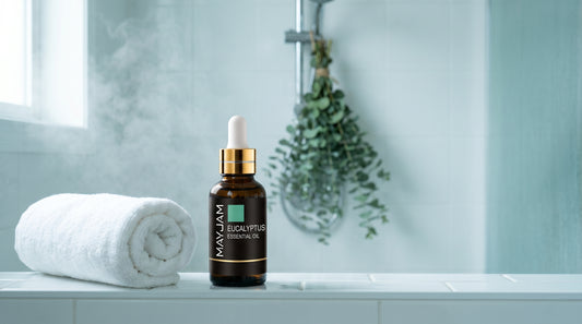 Mayjam Eucalyptus essential oil on a steamy bathroom ledge with hanging eucalyptus