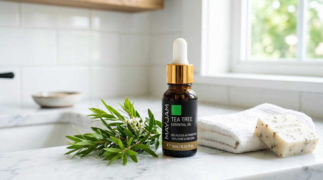 Mayjam Tea Tree essential oil on a clean bathroom vanity with sprigs, towel and natural soap
