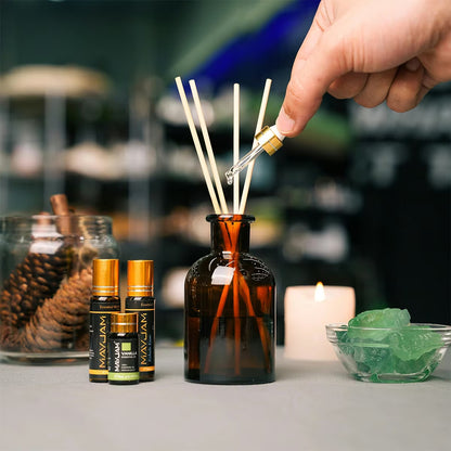 Premium Essential Oils Gift Box 28 Bottles | Aromatherapy Collection | Mayjam - reed diffuser sticks with a hand placing one in a bottle