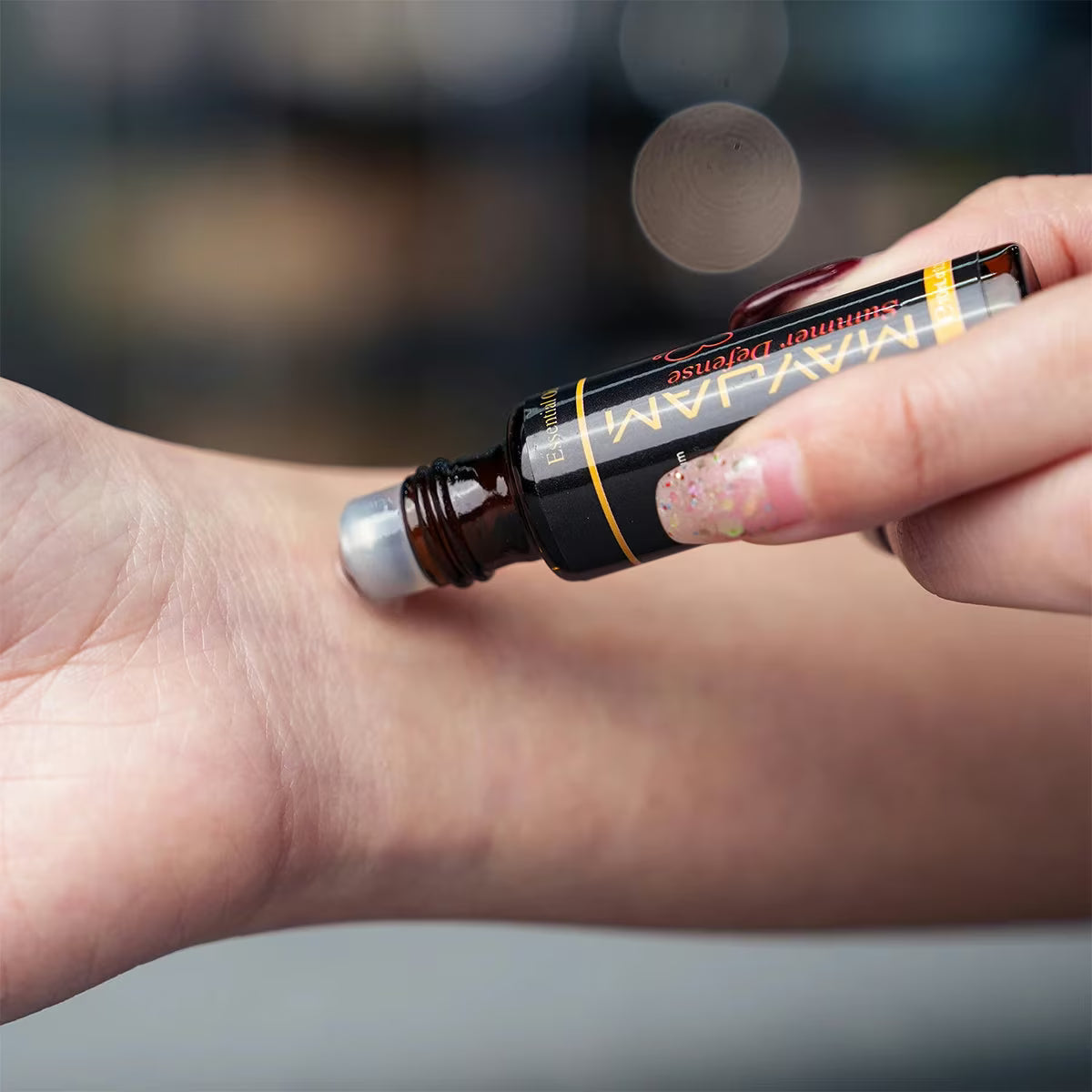 Premium Essential Oils Gift Box 28 Bottles | Aromatherapy Collection | Mayjam - hand applying oil to the wrist