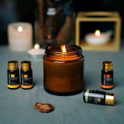 Premium Essential Oils Gift Box 28 Bottles | Aromatherapy Collection | Mayjam - bottles with a lit candle and decorative stones
